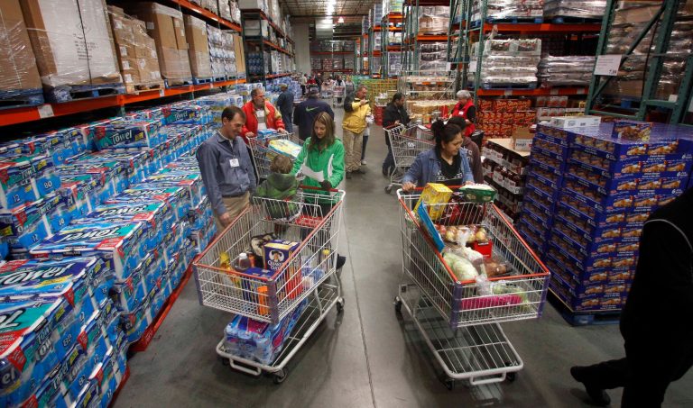 FILE - This Dec. 7, 2011, file photo, shows customers shopping at a Costco, in Portland, Ore. The Commerce Department will release its wholesale trade inventories report, Friday, Oct. 25, 2013. (AP Photo/Rick Bowmer, File)