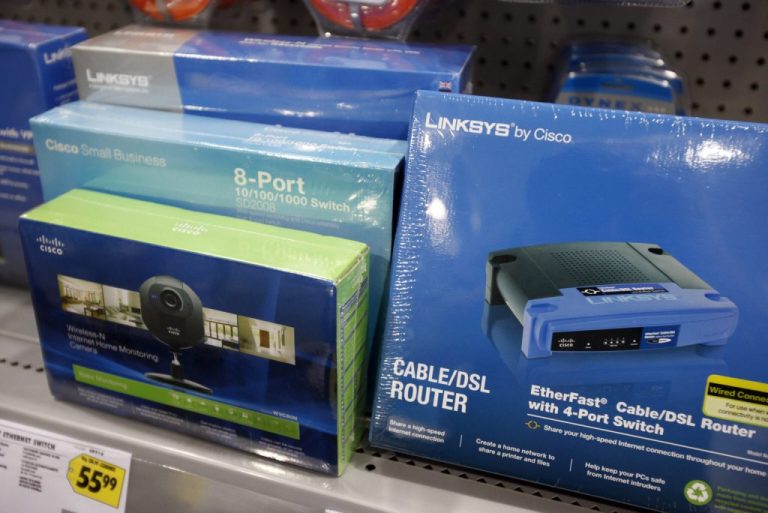 Cable/DSLR routers on a shelf.
