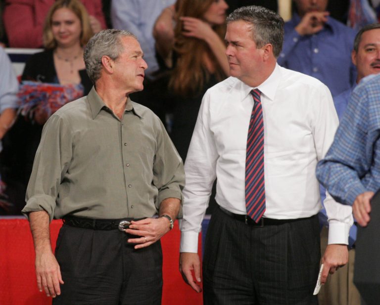 FILE - In this Nov. 6, 2006 file photo, President George W. Bush jokes with his brother, then-Florida Gov. Jeb Bush in Pensacola, Fla., where Bush was drumming up support for local Republican candidates. The question for Jeb Bush, as it had before and is sure to again, came during a meeting with prospective donors. At a table of Republican donors who helped pay for 2012 GOP presidential nominee Mitt Romney's campaign, one wanted to know: How does the former Florida governor plan to distinguish himself from his brother, former President George W. Bush? (AP Photo/Mari Darr~Welch, File)