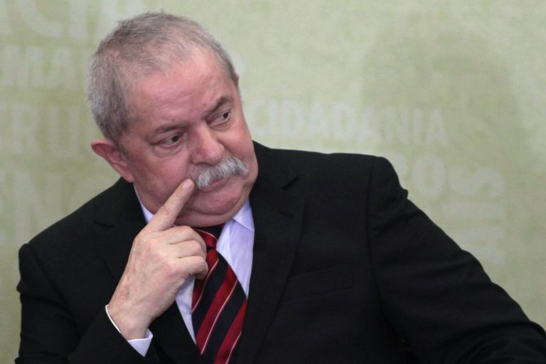   FILE - In this May 16, 2012 file photo, Brazil's former President Luiz Inacio Lula da Silva attends the installation of the Truth Commission at Planalto presidential palace in Brasilia, Brazil. Pressure is growing for prosecutors to open an investigation into popular former President Luiz Inacio Lula da Silva amid new accusations he knew of a cash-for-votes in Congress scheme that has seen 25 people, including his one-time chief of staff, convicted. (AP Photo/Eraldo Peres, File)  