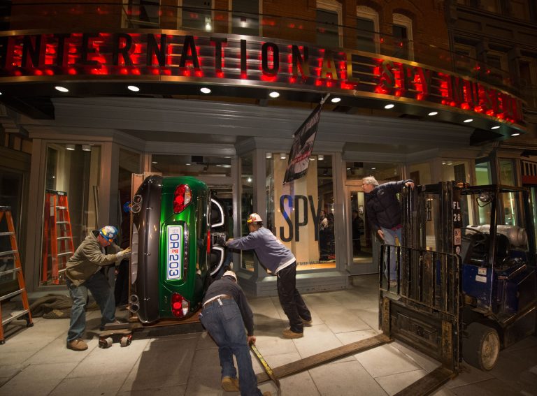 In this photograph provided by the International Spy Museum, workers move the Jaguar XKR used in the James Bond Movie Die Another Day, through the front doors of the Museum, Thursday November 8, 2012 at the International Spy Museum in Washington DC. The car will be a feature of the special exhibit Exquisitely Evil: 50 Years of Bond Villains opening Friday, November 16th.