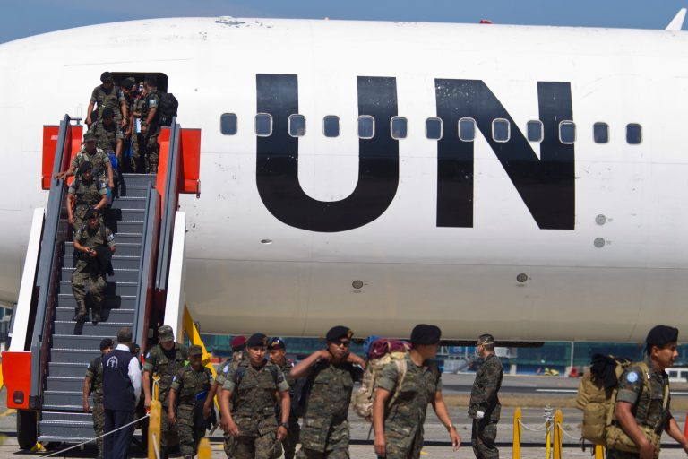 Guatemalan special forces descend from an U.N. aircraft upon arrival to La Aurora International Airport in Guatemala City, Wednesday, March 11, 2015. One hundred and fifty soldiers returned to their country after serving eleven months as U.N. peacekeepers in the Democratic Republic of Congo. (AP Photo/Moises Castillo)