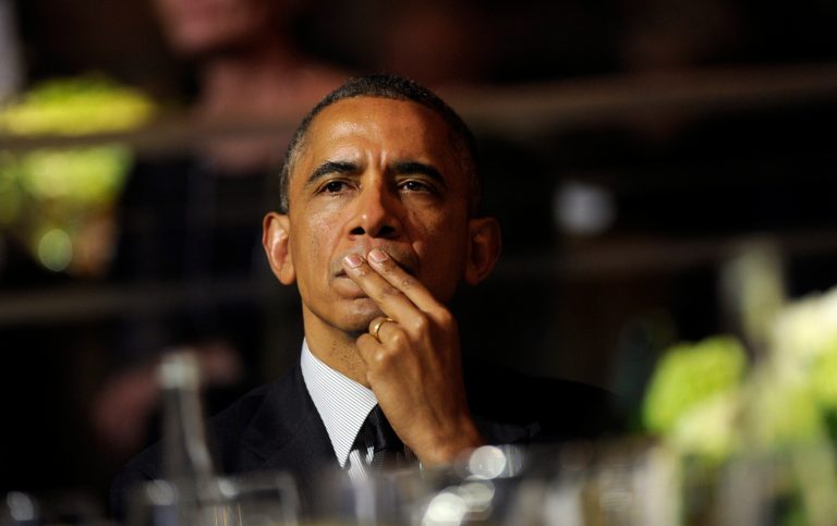 President Barack Obama listens to the remarks of movie director Steven Spielberg as he attends the USC Shoah Foundation's 20th anniversary Ambassadors for Humanity gala in Los Angeles Wednesday. Obama received an award from the foundation created by Spielberg and planned to spend three days in California where he will raise money for the Democratic Party. (AP Photo/Susan Walsh)