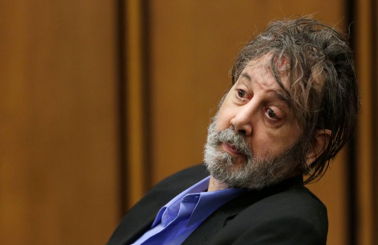 Bobby Thompson, who authorities have identified as Harvard-trained attorney John Donald Cody, looks at the jury during closing statements by the prosecution Wednesday, Nov. 13, 2013, in Cleveland. Thompson is charged with looting the United States Navy Veterans Association, a charity he ran from Tampa, Fla. The charity fraudulently registered with the state of Ohio in 2003 and made annual renewals, the prosecutor said. The charges include racketeering, money laundering, theft and identity theft.(AP Photo/Tony Dejak)