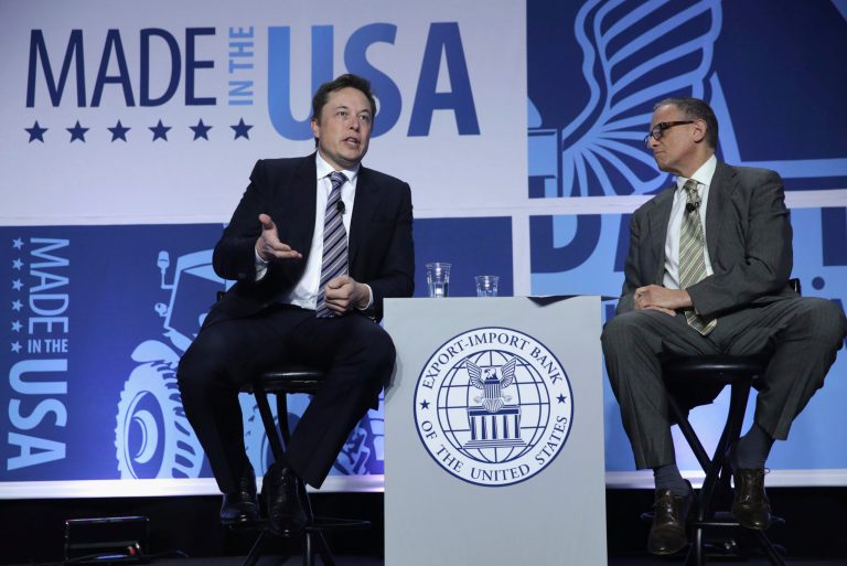 CEO and chief designer of SpaceX Elon Musk, left, and Export-Import Bank chairman and president Fred Hochberg speak at the 2014 annual conference of the Export-Import Bank on April 25, 2014 in Washington. (Photo by Alex Wong/Getty Images)