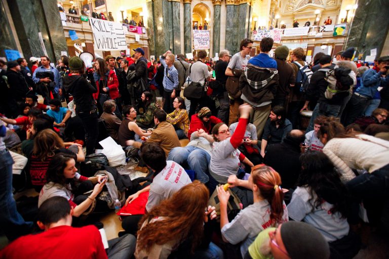 Student Labor Action Coalition members demonstrate at the state Capitol in Madison, Wis., Sunday, Feb. 27, 2011, on the 13th day of protests over the governor's proposed budget. (AP Photo/Andy Manis)