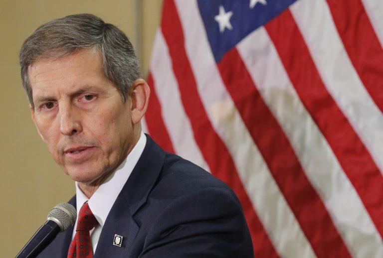 Acting Secretary of Veterans Affairs Sloan Gibson speaks, Thursday, June 5, 2014, in Phoenix. It was Acting Secretary Gibson's first visit to Phoenix since taking over the agency amid an investigation that found 1,700 veterans were kept off the official waiting list for care at the troubled Arizona hospital. (AP Photo/Matt York)