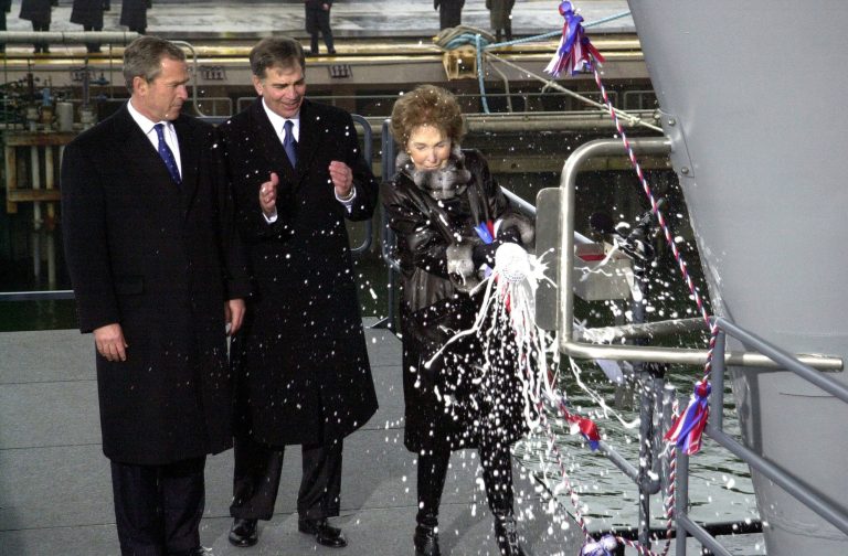 President Bush talks with former First Lady Nancy Reagan March 4, 2001 at the christening of the U.S.S. Ronald Reagan at the Newport News, Virginia Shipbuilding facility. A new report said that shipbuilding would be hit in a budget sequester. (Photo by Eric Draper/White House/Newsmakers)
