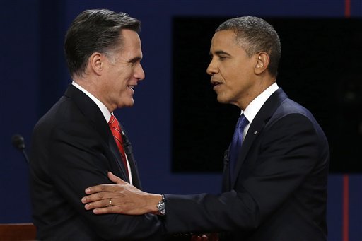 Mitt Romney and President Barack Obama shake hands after the first presidential debate at the University of Denver (AP photo)
