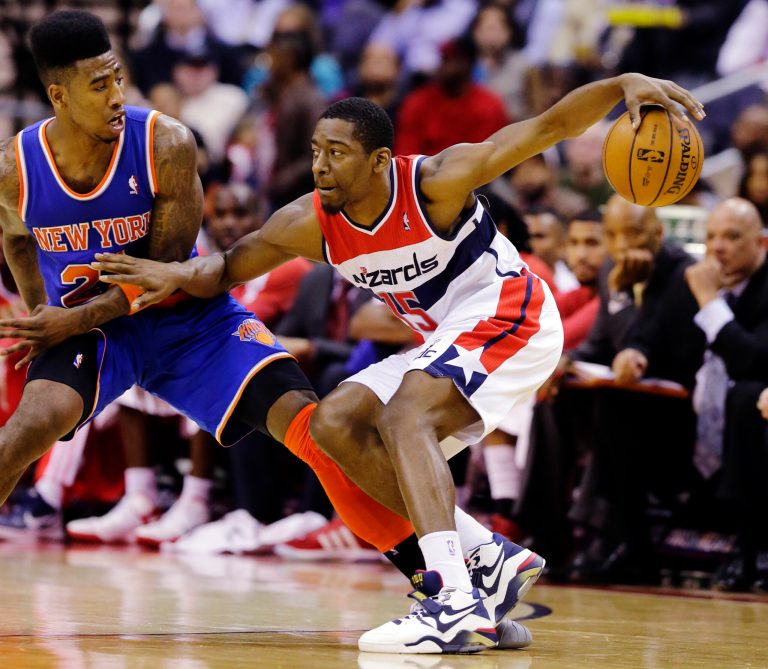 Alex Brandon/AP
Washington guard Jordan Crawford works to get past New York guard Iman Shumpert as the Wizards downed the Knicks 106-96.