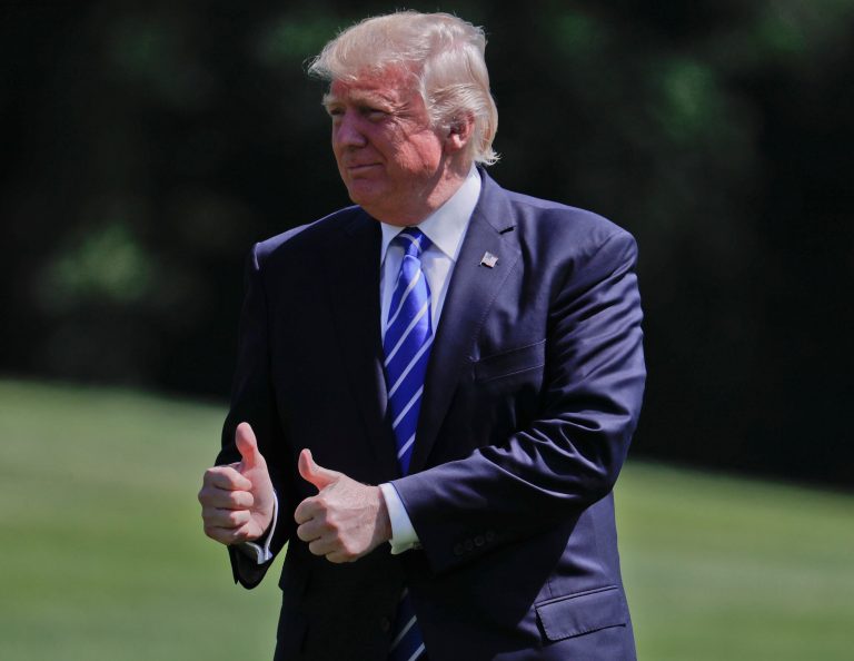 President Donald Trump gives a 'thumbs-up' as he walks across the South Lawn of the White House in Washington, Wednesday, May 17, 2017, following his short trip on Marine One from nearby Andrews Air Force Base, Md. Trump was returning to Washington after speaking at today's U.S. Coast Guard Academy Commencement Ceremony. (AP Photo/Pablo Martinez Monsivais)