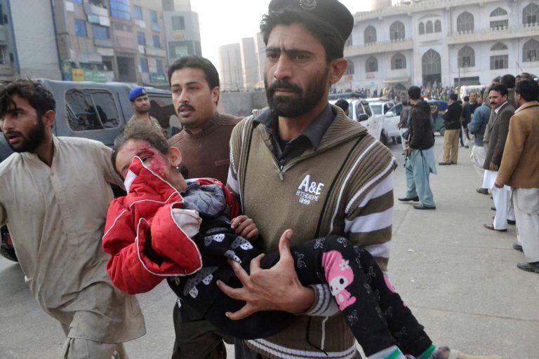 A Pakistani girl who was injured in a Taliban attack on a school, is rushed to a hospital in Peshawar, Pakistan. (AP/Mohammad Sajjad)
