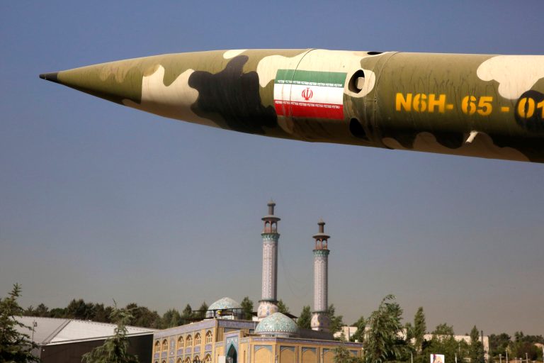 A missile is displayed at an exhibition on the 1980-88 Iran-Iraq war at a park in northern Tehran, Iran, Thursday, Sept. 25, 2014. (AP Photo/Vahid Salemi)