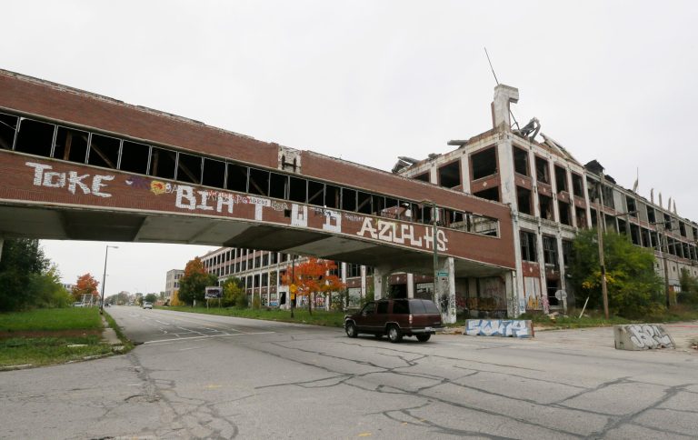 The Packard Plant is seen in Detroit, Friday, Oct. 17, 2014, more than 50 years after the last car was produced there. A developer from Peru bid $405,000 for the property during a tax foreclosure auction last year. Fernando Palazuelo hopes to breathe new life into the 40 blighted acres with homes, retail, offices, recreation and light industry. Crews started demolishing part of the plant on Friday. (AP Photo/Carlos Osorio)