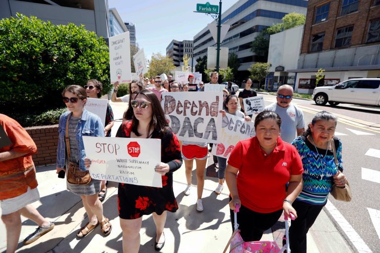 Protesters representing various human rights organizations, immigrants, students and DACA recipients march to the federal building in downtown Jackson, Miss., Sept. 8, 2017. (AP Photo/Rogelio V. Solis)