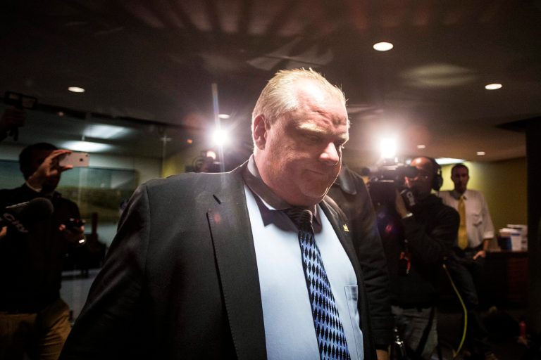 FILE - In this Jan. 22, 2014 file photo, Toronto Mayor Rob Ford leaves his office in Toronto's City Hall. Ford is being sued by his sister's ex-boyfriend for allegedly conspiring to have the man beaten in jail to prevent his illicit behaviors from becoming known, according to a suit submitted Wednesday, Jan. 29, 2014. (AP Photo/The Canadian Press, Chris Young, File)