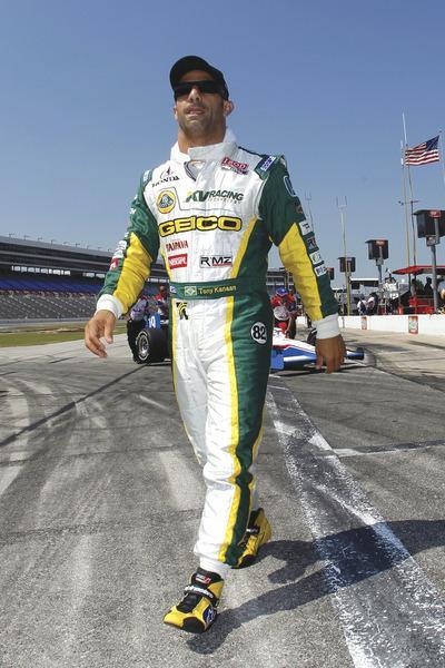 FORT WORTH, TX-JUNE 10: Tony Kanaan of Brazil, driver of the#82 Lotus KV Racing Technologies Dallara Honda, walks on pit road during qualifying for the IZOD IndyCar Series Firestone Twin 275's at Texas Motor Speedway on June 10, 2011 in Fort Worth, Texas.(Photo by Todd Warshaw/Getty Images)