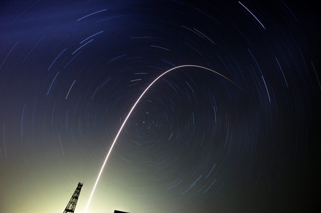 Spaceship with 3-man crew docks at space station