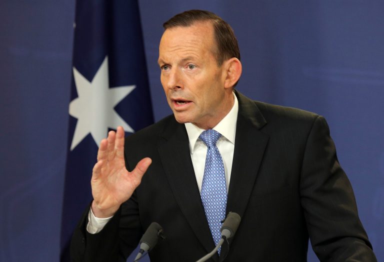 FILE - Australia's Prime Minister Tony Abbott speaks during a news conference in Sydney, Australia, in this July 19, 2014 file photo. Abbott said on Wednesday July 23, 2014 he was discussing with government leaders options for securing the 50-square kilometer (20-square mile) crash site, including his preferred option of a multinational security force mounted by countries such as Australia, Netherlands and Malaysia that lost citizens in the disaster. (AP Photo/Rob Griffith, File)