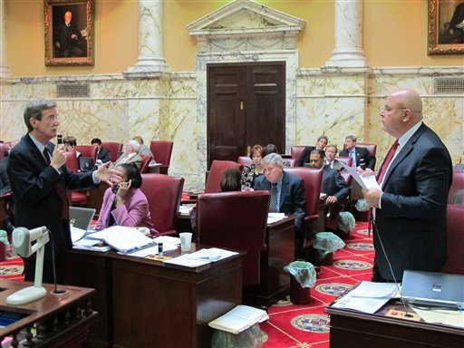 Democratic Sen. Brian Frosh, left, discusses a Maryland gun-control bill with Sen. E.J. Pipkin, R-Cecil, on Tuesday. (AP Photo/Brian Witte)