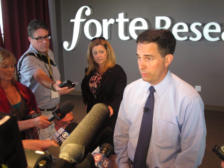 Gov. Scott Walker says he will not make a job-creation promise for his second term during a news conference Tuesday, Sept. 2, 2014, in Madison. Wis. Walker said Tuesday that his economic development plan to be unveiled in coming weeks will be a detailed proposal about how to grow jobs, but it won't include a specific promise of how many jobs would be created. Walker promised during his first campaign for governor in 2010 that if elected he would make sure the state added 250,000 private-sector jobs over his first term. Based on the latest figures, only about 103,000 jobs have been added.  (AP Photo/Scott Bauer)