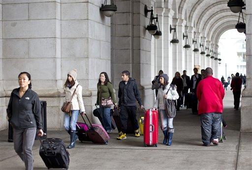 Thanksgiving travelers come and go at Union Station in Washington, Wednesday, Nov. 23, 2011.