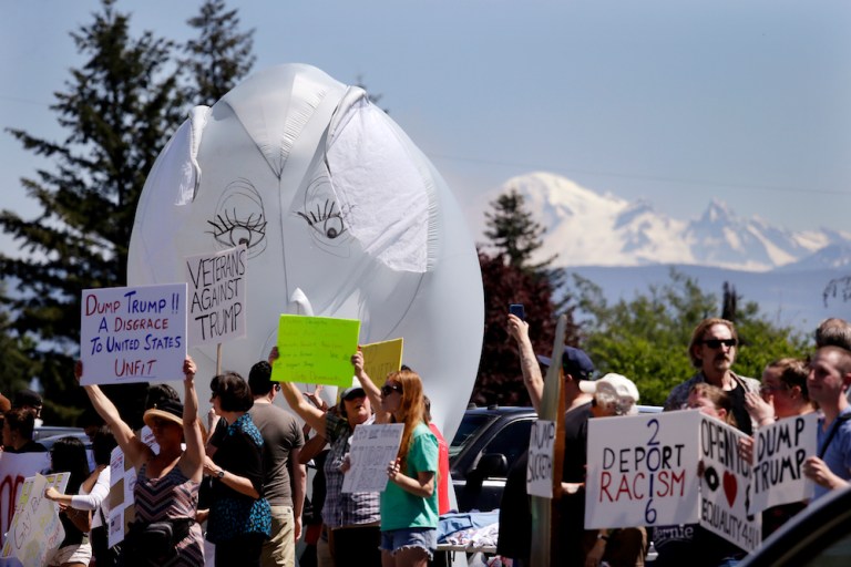Environmentalists vowed to stop Trump from entering the White House this week. (AP Photo/Elaine Thompson)