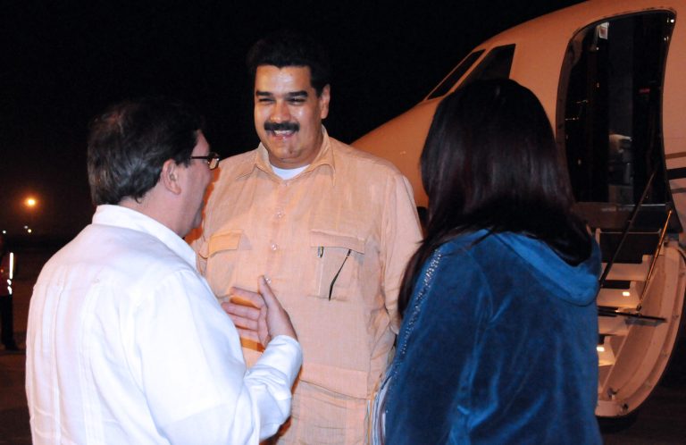   In this photo provided by Cuba's state newspaper Granma, Cuban Foreign Minister Bruno Rodriguez , left, talks with Venezuela's Vice President Nicolas Maduro, center, as Venezuelan Attorney General Cilia Flores watches at the Jose Marti International Airport in Havana on Saturday, Dec. 29, 2012. Maduro arrived in Cuba to visit Venezuelan President Hugo Chavez, who is recovering from a surgery_ his fourth operation related to his pelvic cancer since June 2011. (AP Photo/Granma, Juvenal Balan Neyra )  