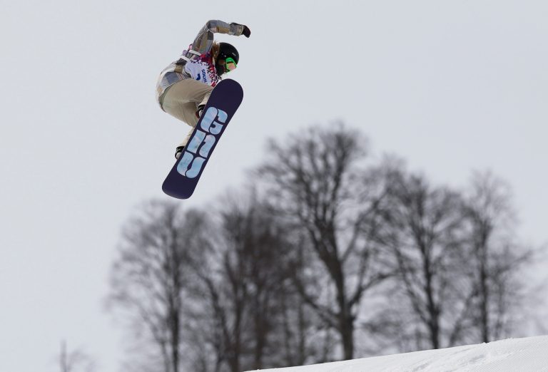 Jamie Anderson of the United States takes a jump on her final run in the women's snowboard slopestyle final at the 2014 Winter Olympics, Sunday, Feb. 9, 2014, in Krasnaya Polyana, Russia.  (AP Photo/Andy Wong)