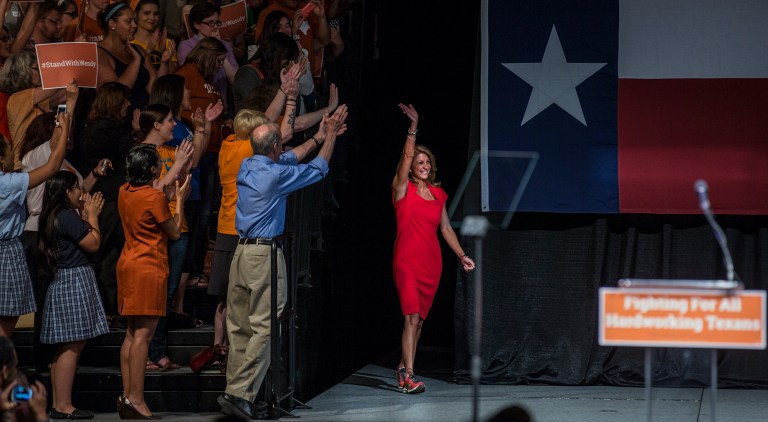 Wendy Davis waves to supporters at the Palmer Events center in Austin, Texas on Wednesday, June 25, 2014. Davis celebrated Wednesday night the anniversary of her star-making filibuster over Texas abortion restrictions by rallying supporters who are eager to recapture the defiant energy of last summer and reinvigorate her underdog campaign for governor. (AP Photo/Austin American-Statesman, Ricardo B. Brazziell) AUSTIN CHRONICLE OUT, COMMUNITY IMPACT OUT, INTERNET AND TV MUST CREDIT PHOTOGRAPHER AND STATESMAN.COM, MAGS OUT