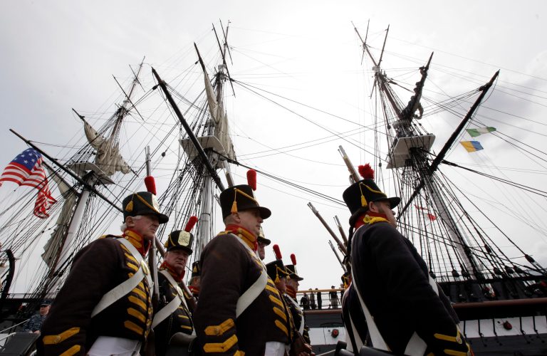 FILE - This Aug. 19, 2012 file photo shows military re enactors in the uniforms of U.S. Marines from the War of 1812, marching in front of the USS Constitution, the U.S. Navy's oldest commissioned warship, moments after the vessel arrived at her berth in Charlestown Navy Yard in Boston to commemorate the 200th anniversary of the ship's victory over HMS Guerriere in the War of 1812. One bit of gospel is endlessly recited in the debt limit standoff: The United States has never defaulted. But history's not that simple. America has briefly stiffed some of its creditors on at least two occasions: subsequent to the War of 1812, the U.S. Treasury stood empty in 1814, Washington lay in ruins, and even the soldiers fighting the British weren't getting paid; the second time was blamed partly on lawmakers, who squabbled right down to the deadline before raising the debt limit in 1979, ultimately costing taxpayers billions of dollars. (AP Photo/Steven Senne, File)