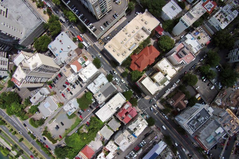 This Sept. 23, 2014 photo, shows an aerial view of the Santurce neighborhood in San Juan, Puerto Rico. The neighborhood is bounded on the north and east by the upscale Atlantic Coast districts of Condado, Ocean Park and Isla Verde, areas familiar to tourists visiting Puerto Rico. To the west lies the largely middle-class area of Miramar and the approach to picturesque Old San Juan, a colonial district of cobblestone streets and the seat of local government. (AP Photo/Ricardo Arduengo)