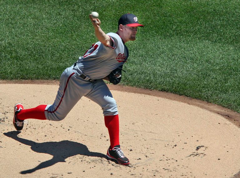 Washington Nationals starting pitcher Stephen Strasburg pitches during the first inning of a baseball game against the New York Mets Wednesday, July 25, 2012 at Citi Field in New York.  (AP Photo/Seth Wenig).