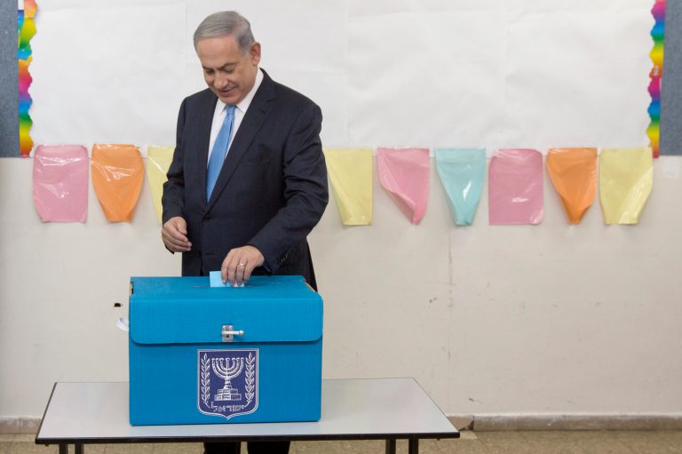 Israeli Prime Minister Benjamin Netanyahu casts his vote during Israel's parliamentary elections in Jerusalem, Tuesday, March 17, 2015. (AP Photo/Sebastian Scheiner, Pool)