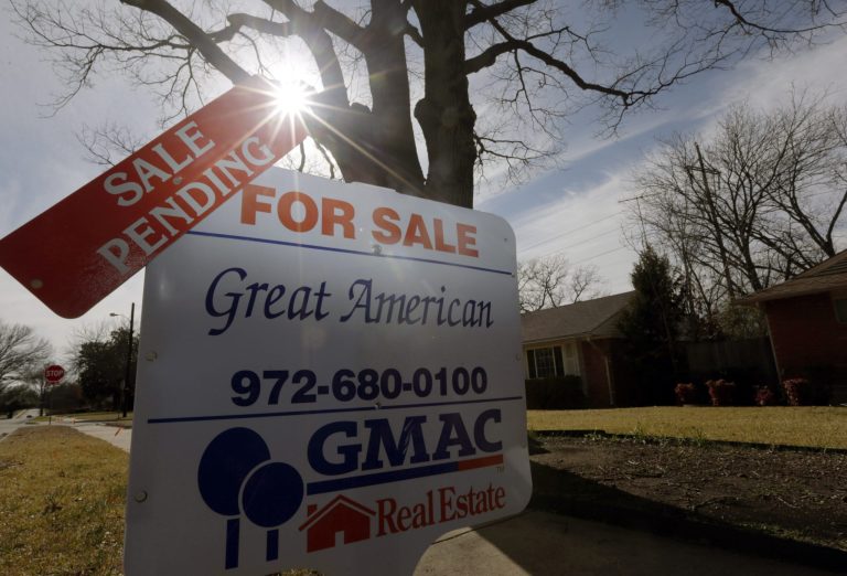 FILE - In this Friday, Feb. 22, 2013 file photo, a sale pending announcement sits atop a for sale sign in a home's yard in Richardson, Texas.  National Association of Realtors releases pending home sales index for November on  Monday, Dec. 30, 2013. (AP Photo/LM Otero, File)