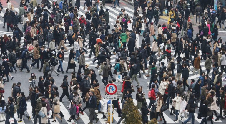In this photo taken Jan. 25, 2014, people cross streets at Tokyo's shopping and entertainment district of Shibuya. Japan's consumer price index rose 0.4 percent in 2013, the first increase in five years, in further evidence the recovery in the world's third-largest economy is gaining momentum. (AP Photo/Koji Sasahara)