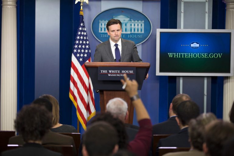 White House spokesman Josh Earnest has changed course several times in responding to Donald Trump since he launched what originally seemed like a novelty campaign. (AP Photo/Evan Vucci)