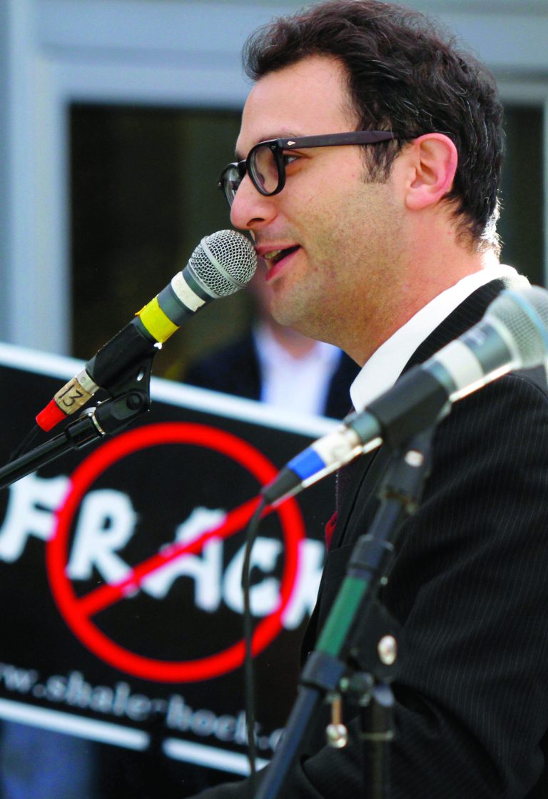 FILE - In this file photo from Nov. 3, 2010, documentary filmmaker Josh Fox speaks at a rally of protestors against Marcellus Shale drilling and hydraulic fracturing in Pittsburgh. Researchers say the claim that fracking has been linked to increased cancer rates in Texas is simply wrong. Fox, an Oscar-nominated filmmaker who uses the claim in a new film, declined to acknowledge the error when told of researchers who say he's doing a disservice to people with cancer by misrepresenting health data. (AP Photo/Keith Srakocic, File)