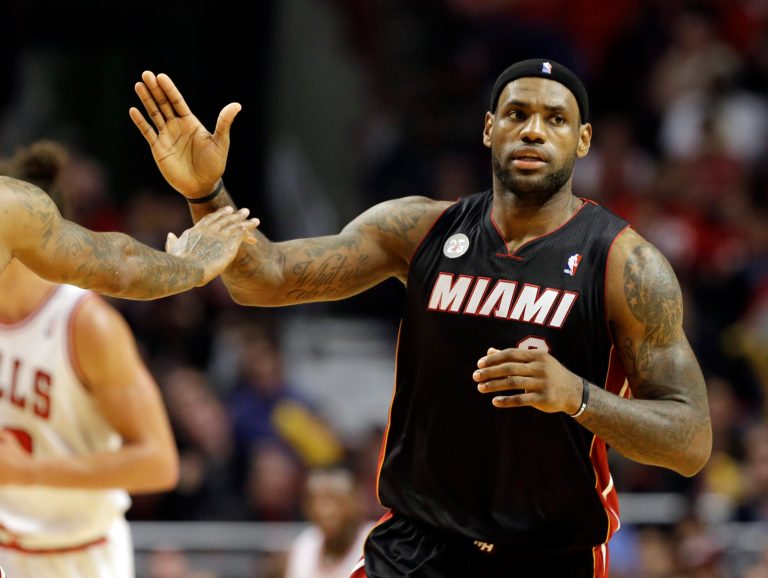 Nam Y. Huh/AP
Heat forward LeBron James had 27 points, eight assists and seven rebounds to lead his team past the Bulls in Game 4 on Monday.