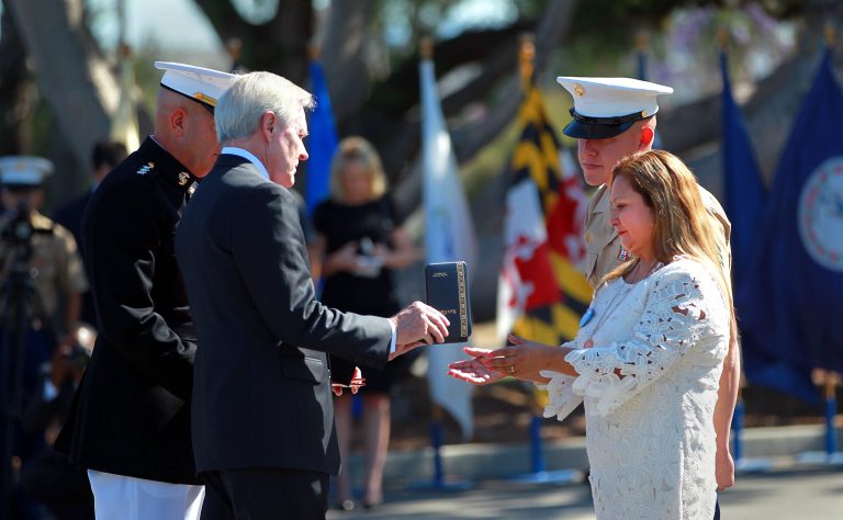 Rosa Peralta, right, mother of Marine Sgt. Rafael Peralta, accepts the Navy Cross presented to her by Navy Secretary Ray Mabus at Camp Pendleton, Calif., Monday, June 8, 2015. (John Gastaldo/San Diego Union-Tribune via AP)