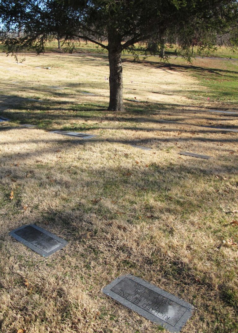   The graves of Perry Edward Smith, lower left, and Richard Eugene Hickock, lower right, sit on a sloping hillside at the Mount Muncie Cemetery, Tuesday, Dec. 4, 2012, in Lansing, Kan. Smith and co-defendant Richard Eugene Hickock, the two men who were the subjects of Truman Capote's iconic book 