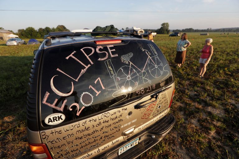 The decorated car of Frank and Mary Ludwig, of La Crescent, Minn., sits at their campsite at the Orchard Dale historical farm near Hopkinsville, Ky. Monday, Aug. 21, 2017. The location, which is in the path of totality of the solar eclipse, is also at the point of greatest intensity. (AP Photo/Mark Humphrey)