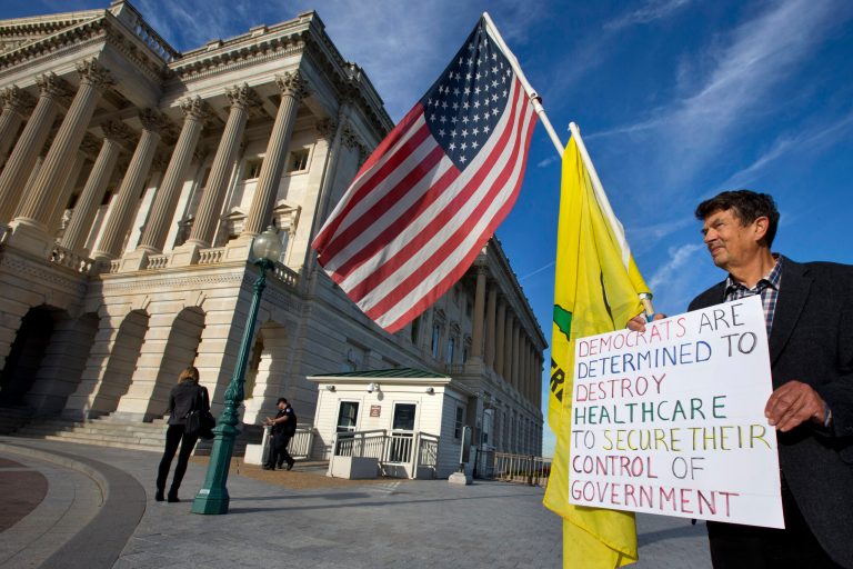 An Obamacare protestor demonstrates outside the Senate side of the Capitol in Washington on Sept. 25. (AP Photo/Jacquelyn Martin)