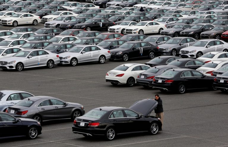 In this March 27, 2014 photo, rows of Mercedes-Benz cars and SUVs await distribution at the company's Vehicle Processing Center in Baltimore. The Commerce Department reports on the U.S. trade deficit for April on Wednesday, June 4, 2014. (AP Photo/Patrick Semansky)