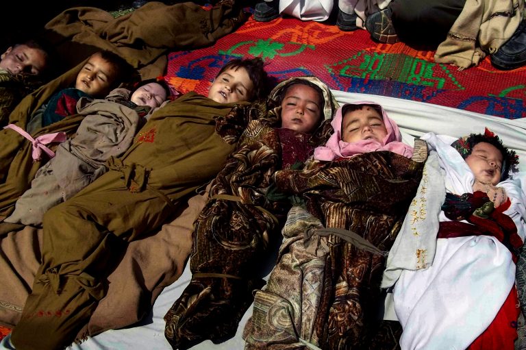 The lifeless bodies of Afghan children lay on the ground before their funeral ceremony, after a NATO airstrike killed several Afghan civilians, including ten children during a fierce gun battle with Taliban militants in Shultan, Shigal district, Kunar, eastern Afghanistan, Sunday, April 7, 2013. The U.S.-led coalition confirms that airstrikes were called in by international forces during the Afghan-led operation in a remote area of Kunar province near the Pakistan border. (AP Photo/Naimatullah Karyab)
