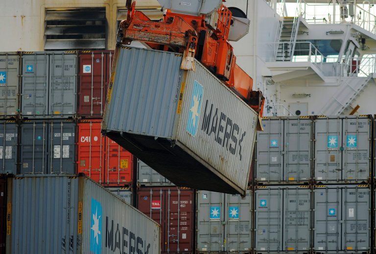 In this Monday, Jan. 27, 2014, photo, a  ship to shore crane unloads a shipping container at the Georgia Ports Authority Garden City terminal, in Savannah, Ga. The Commerce Department releases wholesale trade inventories for December on Tuesday, Feb. 11, 2014. (AP Photo/Stephen B. Morton)