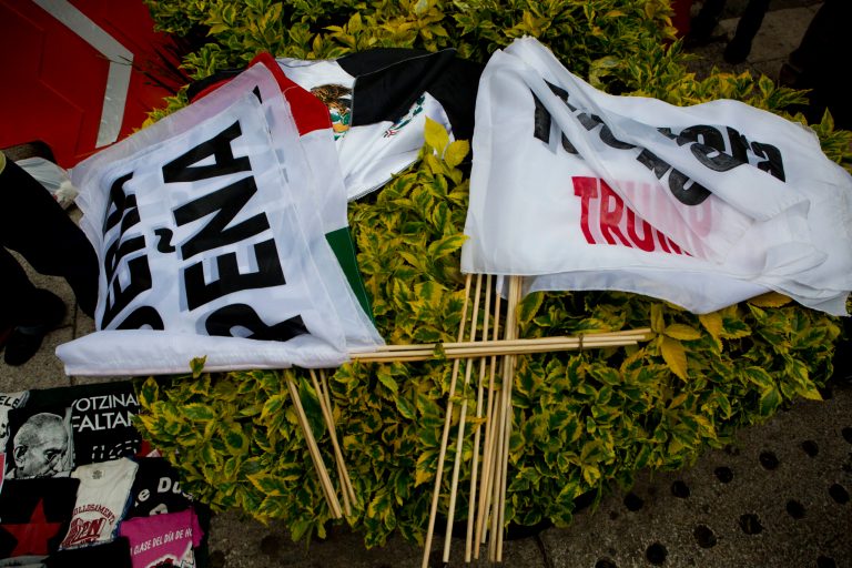A vendor displays flags reading, 