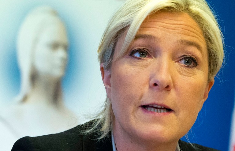 French far-right National Front party leader Marine Le Pen speaks during a meeting at their headquarters in Nanterre, west of Paris, Tuesday, May 27, 2014. The anti-EU, anti-immigration National Front party shook France's political landscape by coming out on top in France's voting for European Parliament elections, beating the mainstream conservatives and the governing Socialists. (AP Photo/Jacques Brinon)