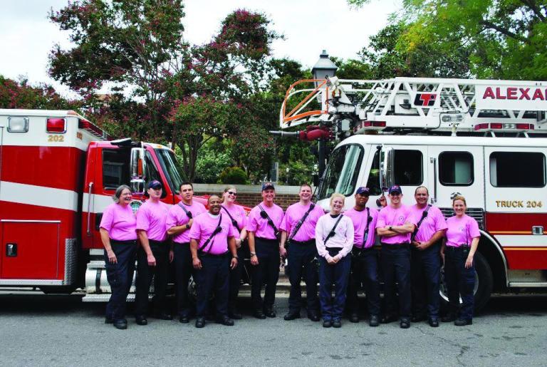 Alexandria firefighters sport pink shirts as part of breast cancer awareness month.