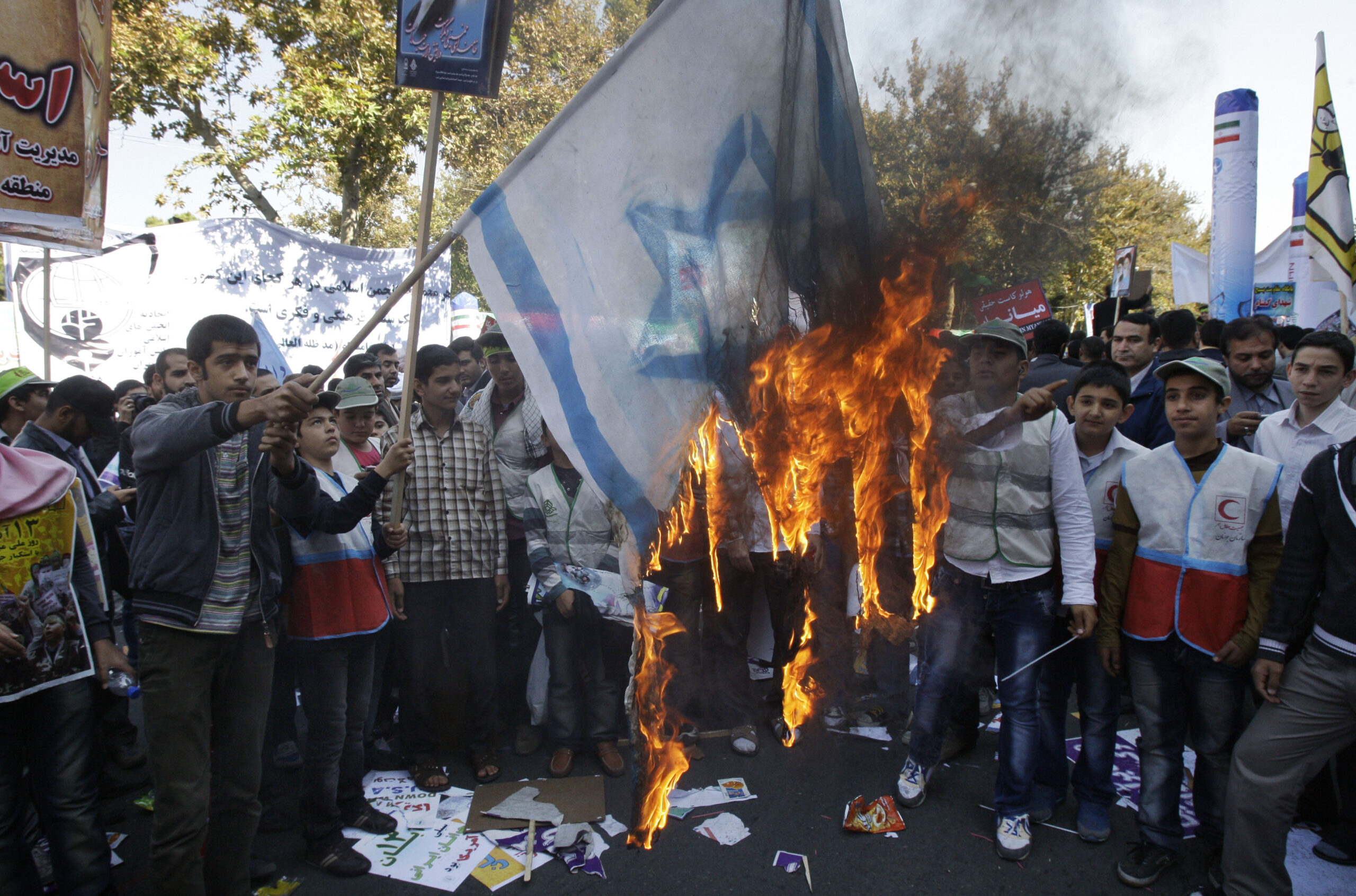 No nuclear deal, but Iran burns American flags on holiday